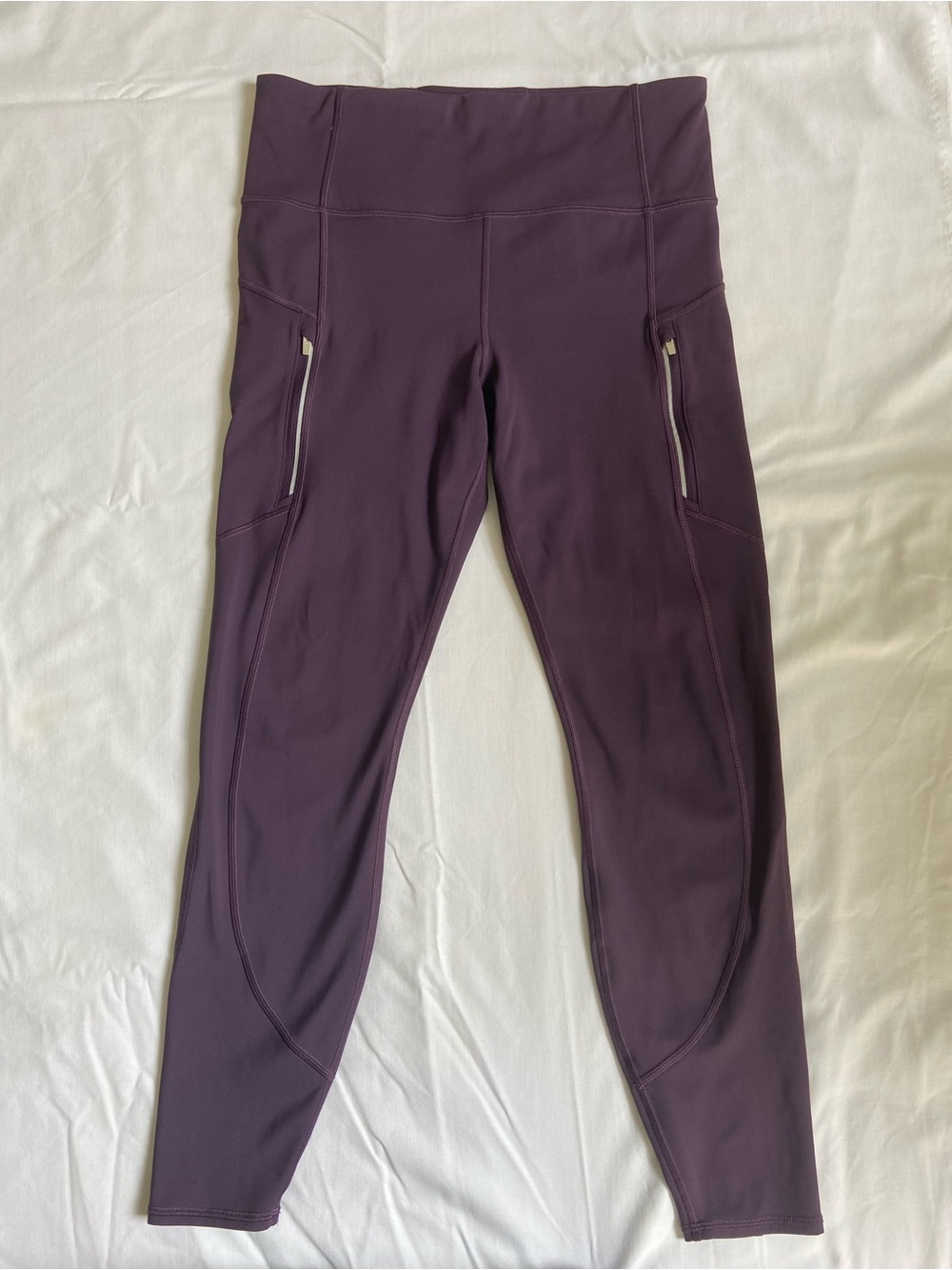 Athleta Women’s Rainier Leggings, size Medium Regular, plum purple.